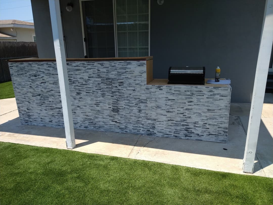 custom tile backsplash for the exterior of a home